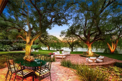 a view of a backyard with sitting area