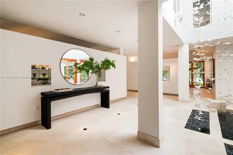 a living room with furniture a rug and a large window