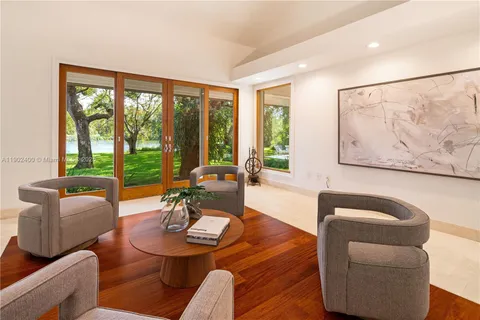 a bathroom with a sink a bathtub and next to a window