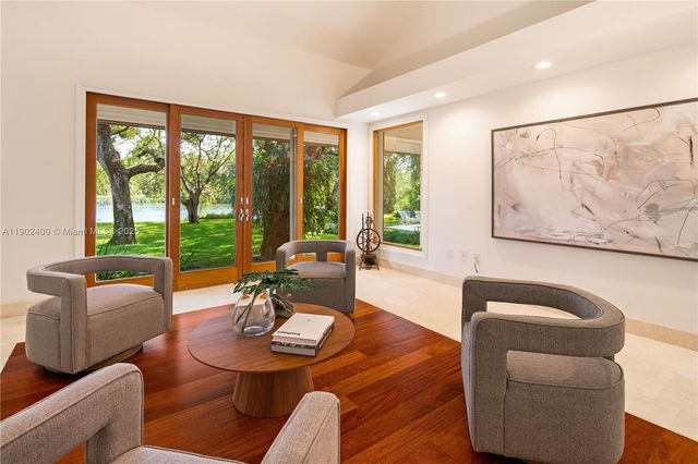 a bathroom with a sink a bathtub and next to a window