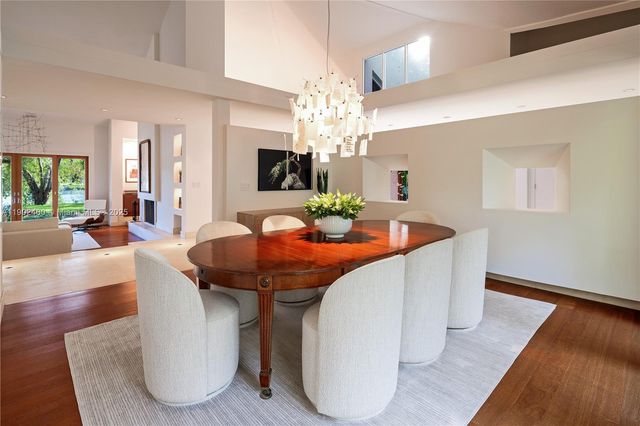 a bedroom with a large bed and a large window