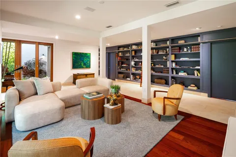 a view of swimming pool with outdoor seating and trees