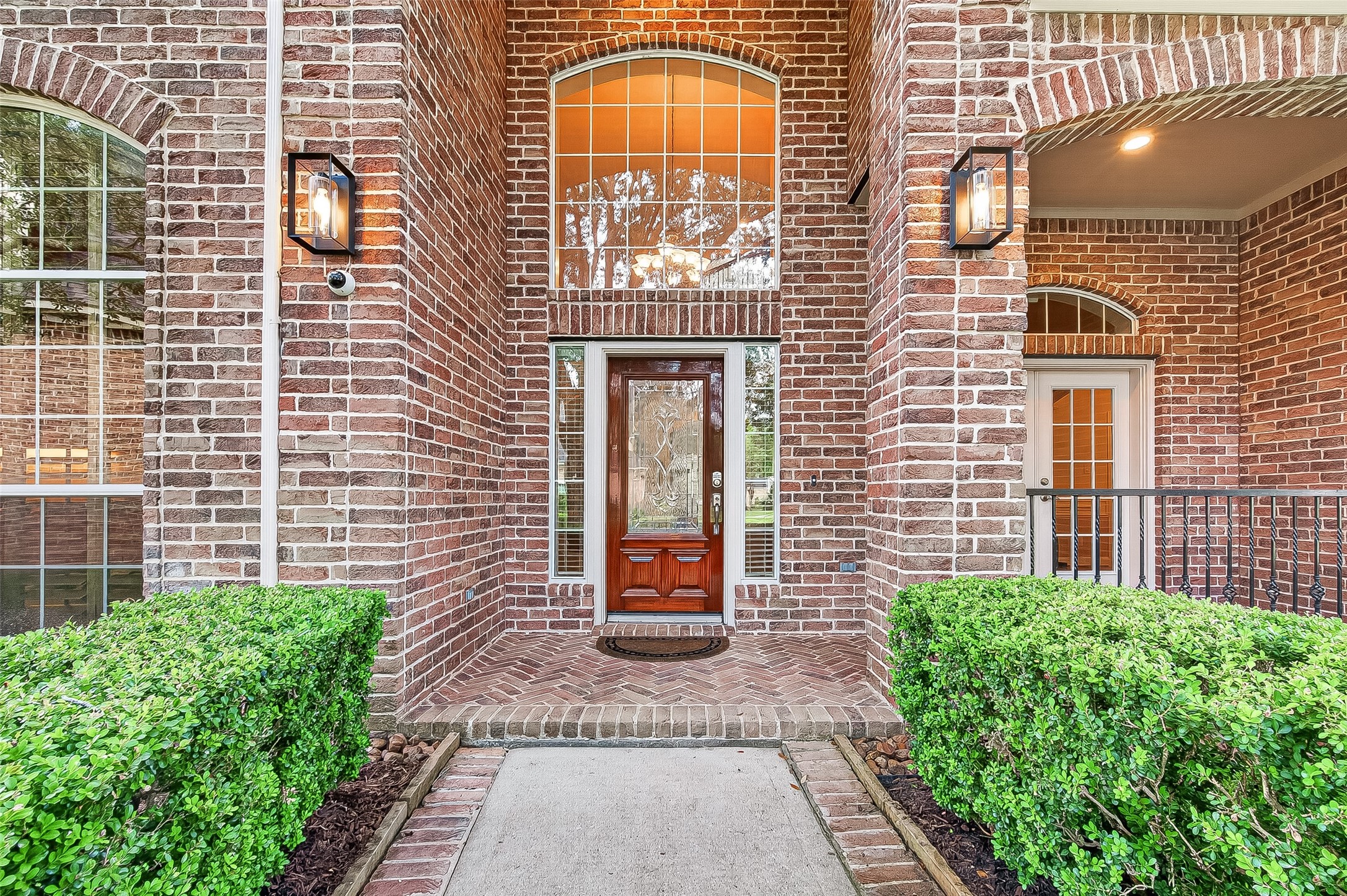 4203 Deforest Ridge Circle Katy, TX 77494 - Photo 4 of 50 An extra-wide, brick-accented walkway guides you to a charming covered front porch - ideal for morning coffee or watching the world go by