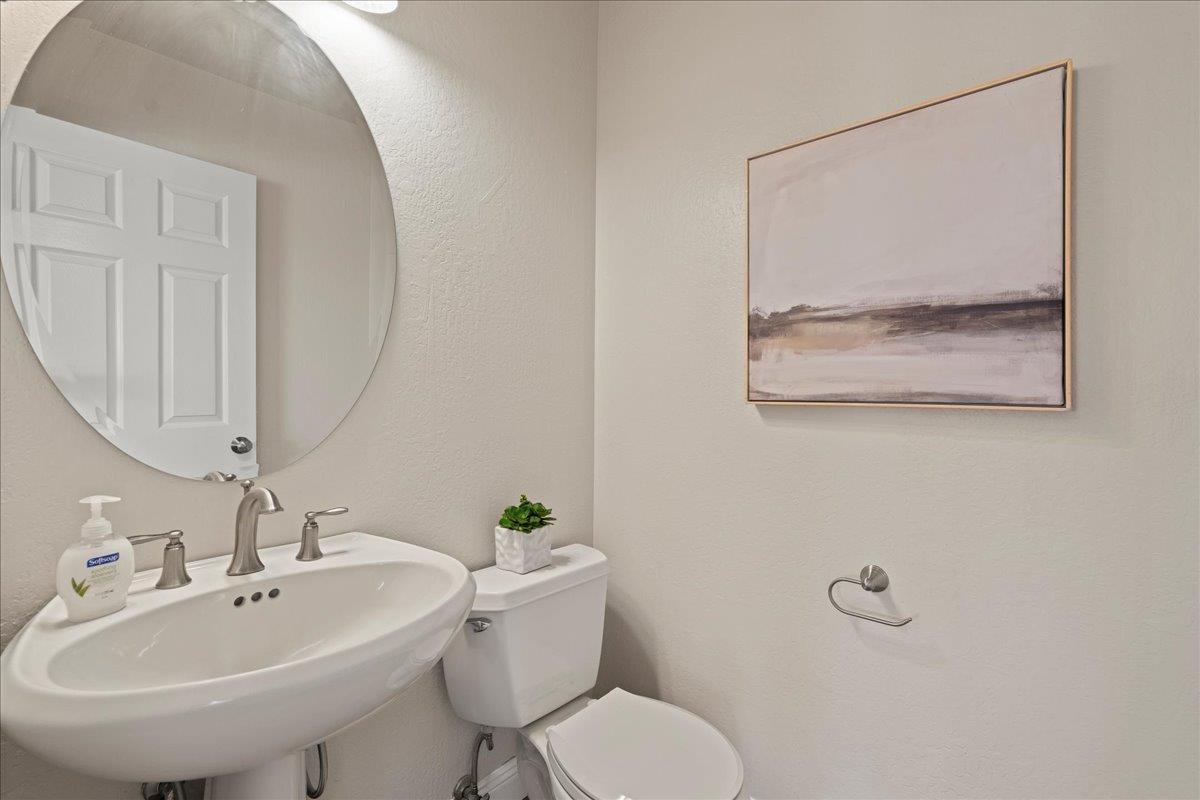25400 Radonich Road Los Gatos, CA 95033 - Photo 21 of 42 a bathroom with a sink and mirror with toilet
