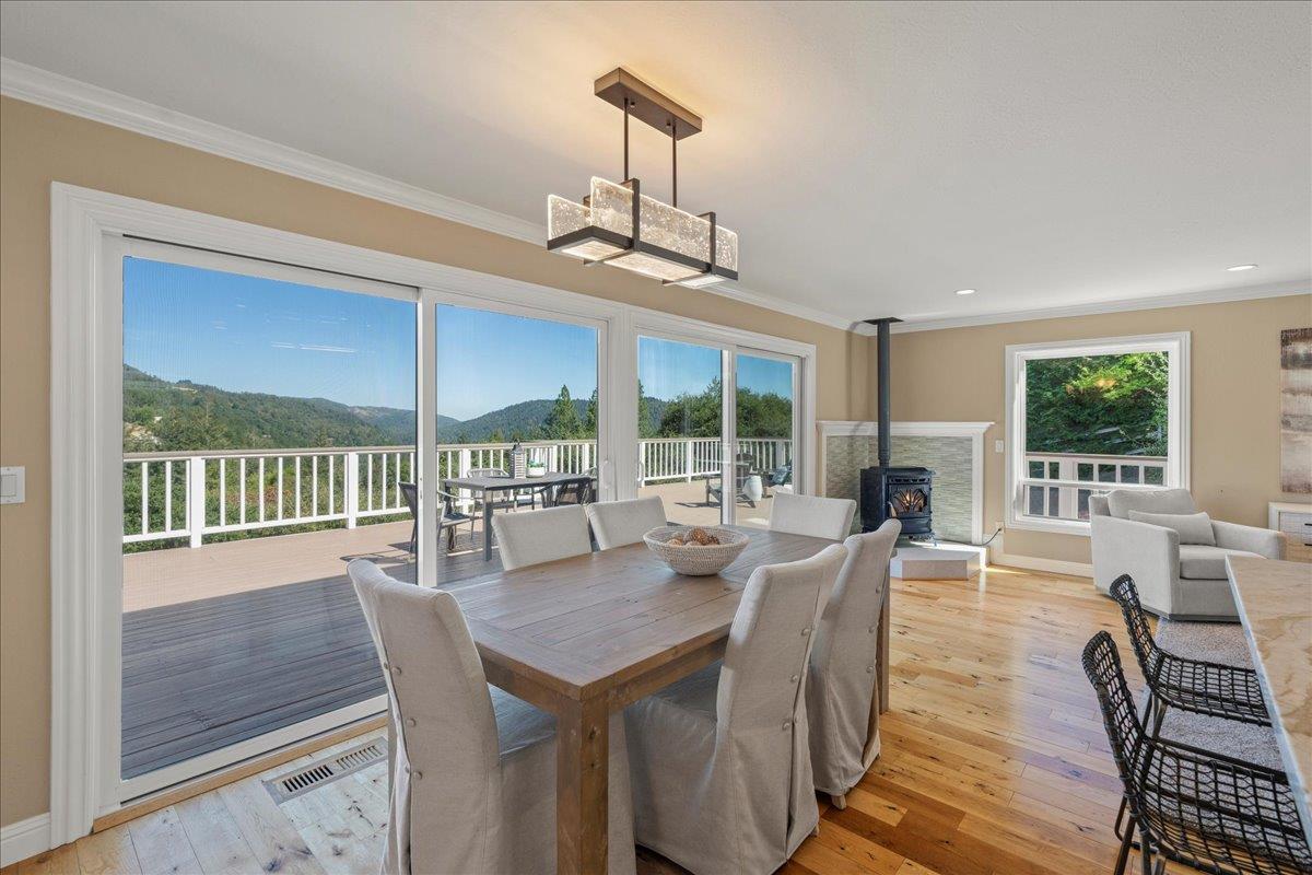 25400 Radonich Road Los Gatos, CA 95033 - Photo 7 of 42 a view of a dining room with furniture large windows and wooden floor