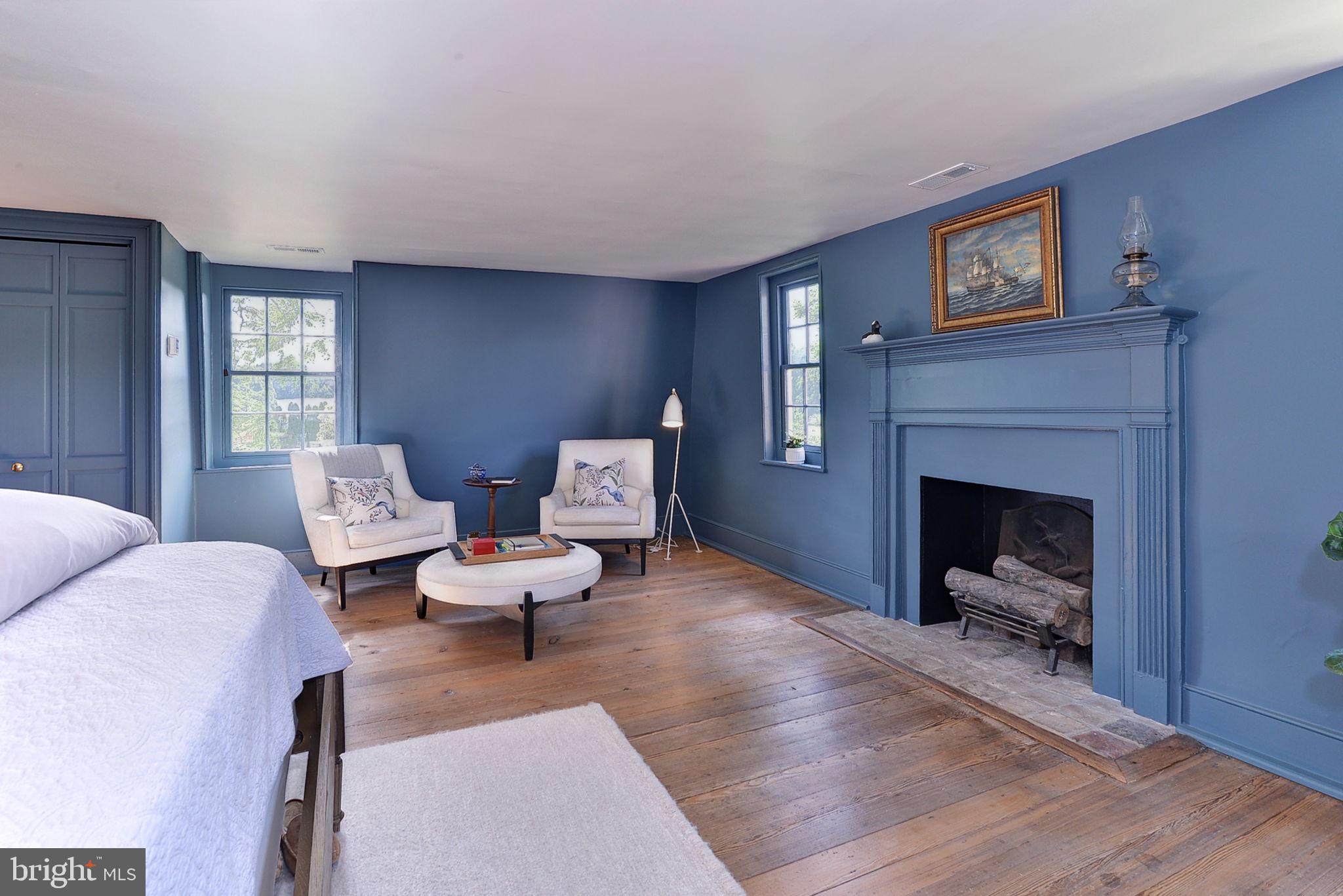 2459 Dunbrooke Road Tappahannock, VA 22560 - Photo 44 of 85 a living room with furniture and a fireplace