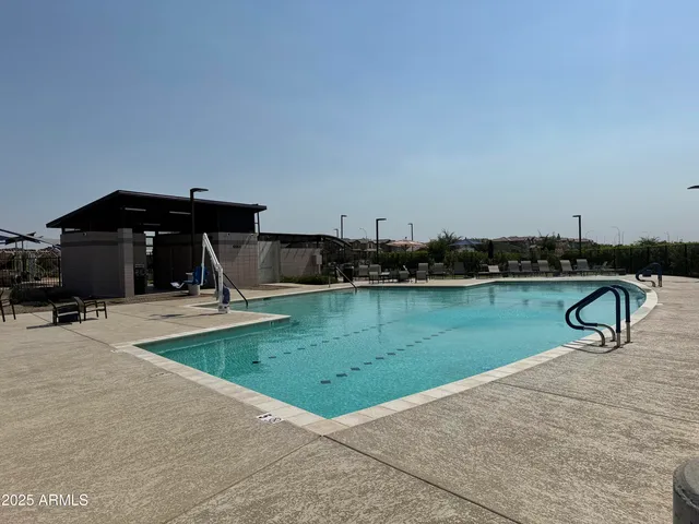 a view of a swimming pool and a yard