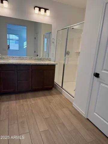 a bathroom with a vanity mirror and a sink