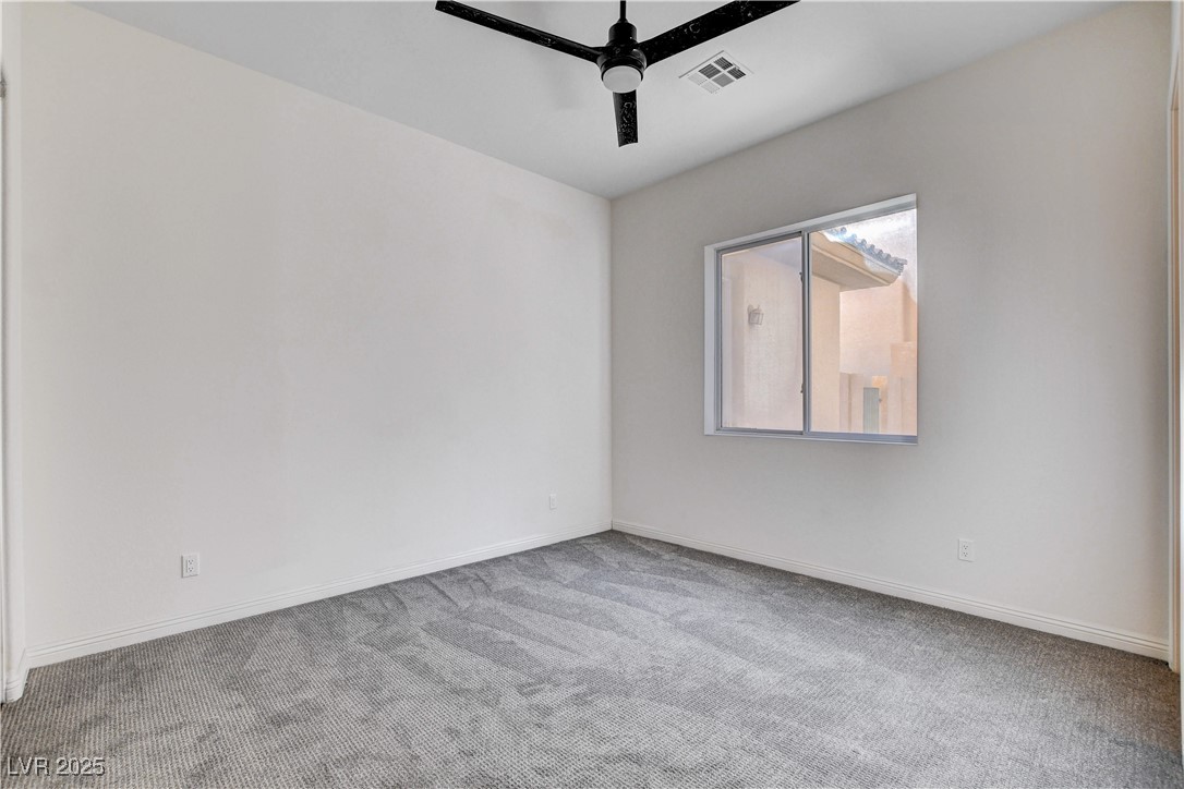 5148 Villa Vecchio Court Las Vegas, NV 89141 - Photo 29 of 71 Carpeted empty room with visible vents, baseboards, and a ceiling fan
