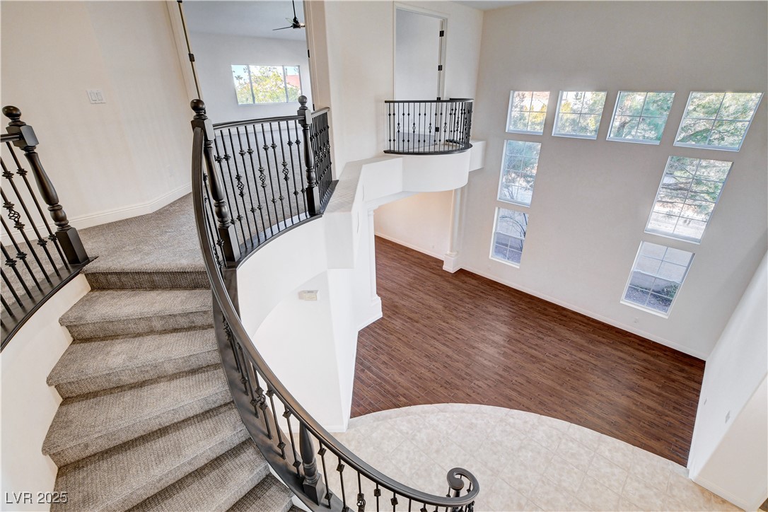 5148 Villa Vecchio Court Las Vegas, NV 89141 - Photo 32 of 71 Stairway featuring ceiling fan, baseboards, and wood finished floors