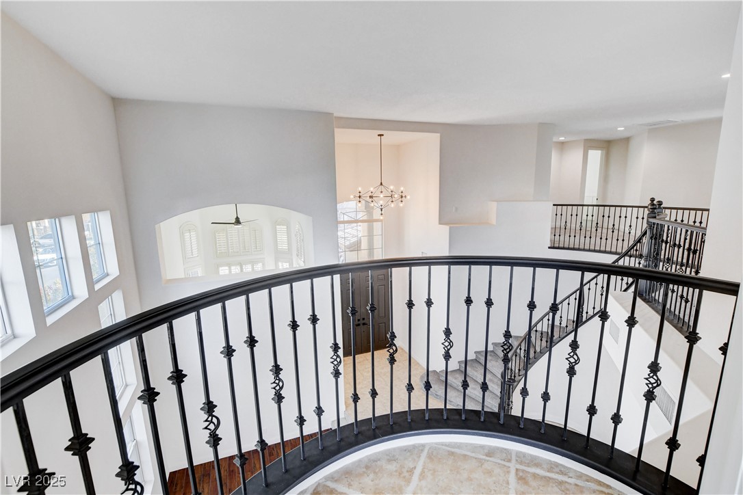 5148 Villa Vecchio Court Las Vegas, NV 89141 - Photo 42 of 71 Staircase with a chandelier