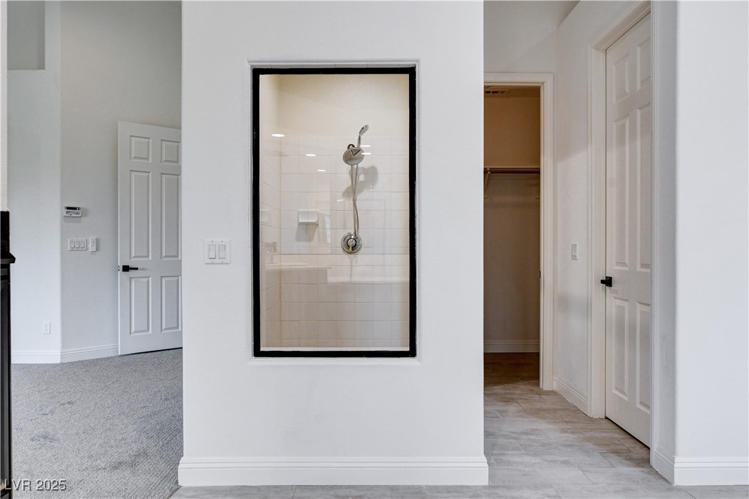 5148 Villa Vecchio Court Las Vegas, NV 89141 - Photo 47 of 71 Hallway with baseboards and light carpet