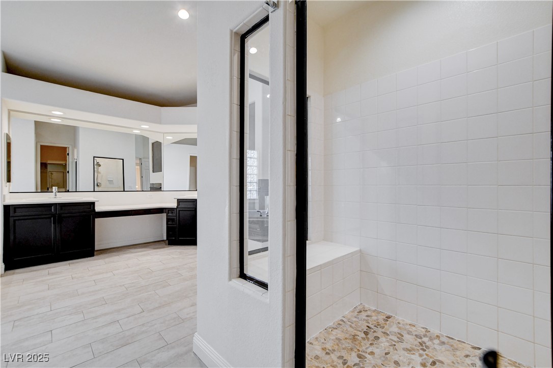5148 Villa Vecchio Court Las Vegas, NV 89141 - Photo 49 of 71 Bathroom with vanity, recessed lighting, wood finished floors, and tiled shower