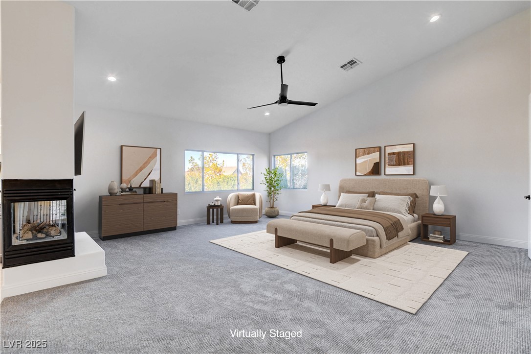 5148 Villa Vecchio Court Las Vegas, NV 89141 - Photo 5 of 71 Bedroom with carpet flooring, recessed lighting, a multi sided fireplace, and high vaulted ceiling