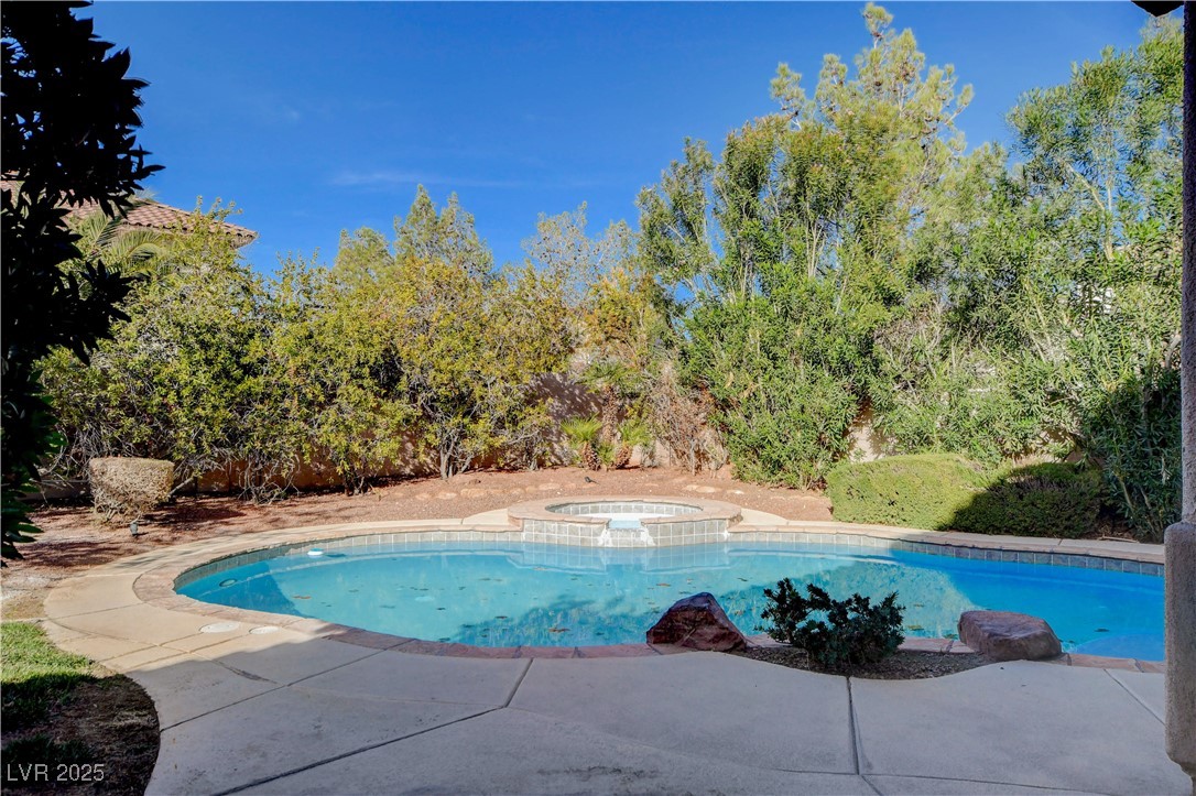 5148 Villa Vecchio Court Las Vegas, NV 89141 - Photo 68 of 71 View of swimming pool with a pool with connected hot tub