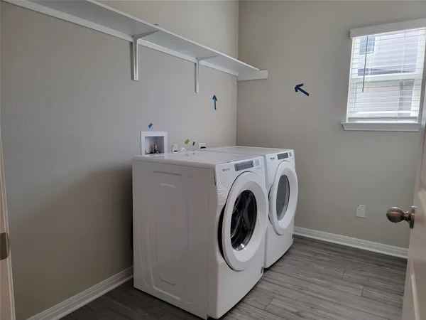 a utility room with dryer and washer