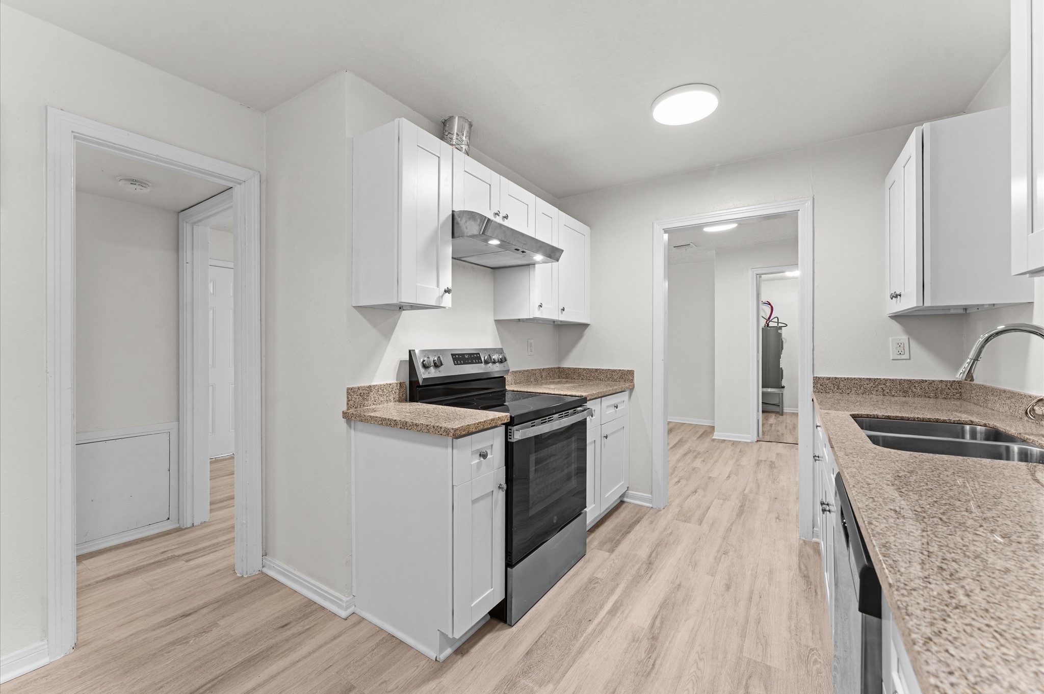 6515 Beekman Road Houston, TX 77021 - Photo 13 of 30 a kitchen with stainless steel appliances a stove a sink and a refrigerator