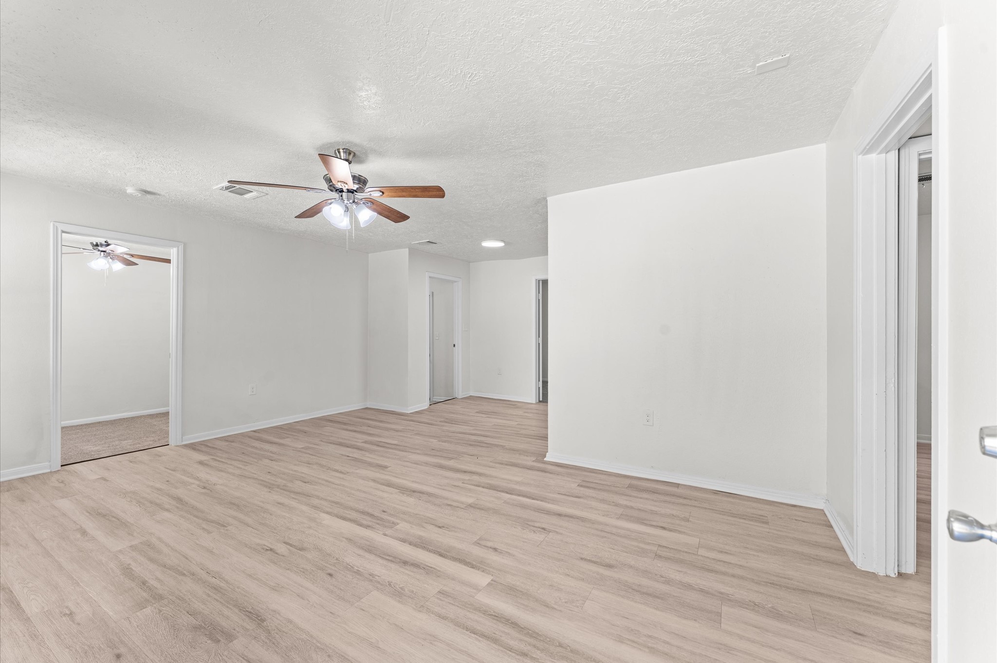 6515 Beekman Road Houston, TX 77021 - Photo 8 of 30 a view of an empty room with wooden floor