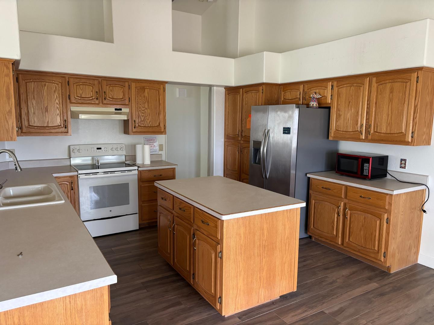 43003 North Old Mine Road Scottsdale, AZ 85262 - Photo 11 of 33 a kitchen with stainless steel appliances a stove a sink dishwasher and a refrigerator