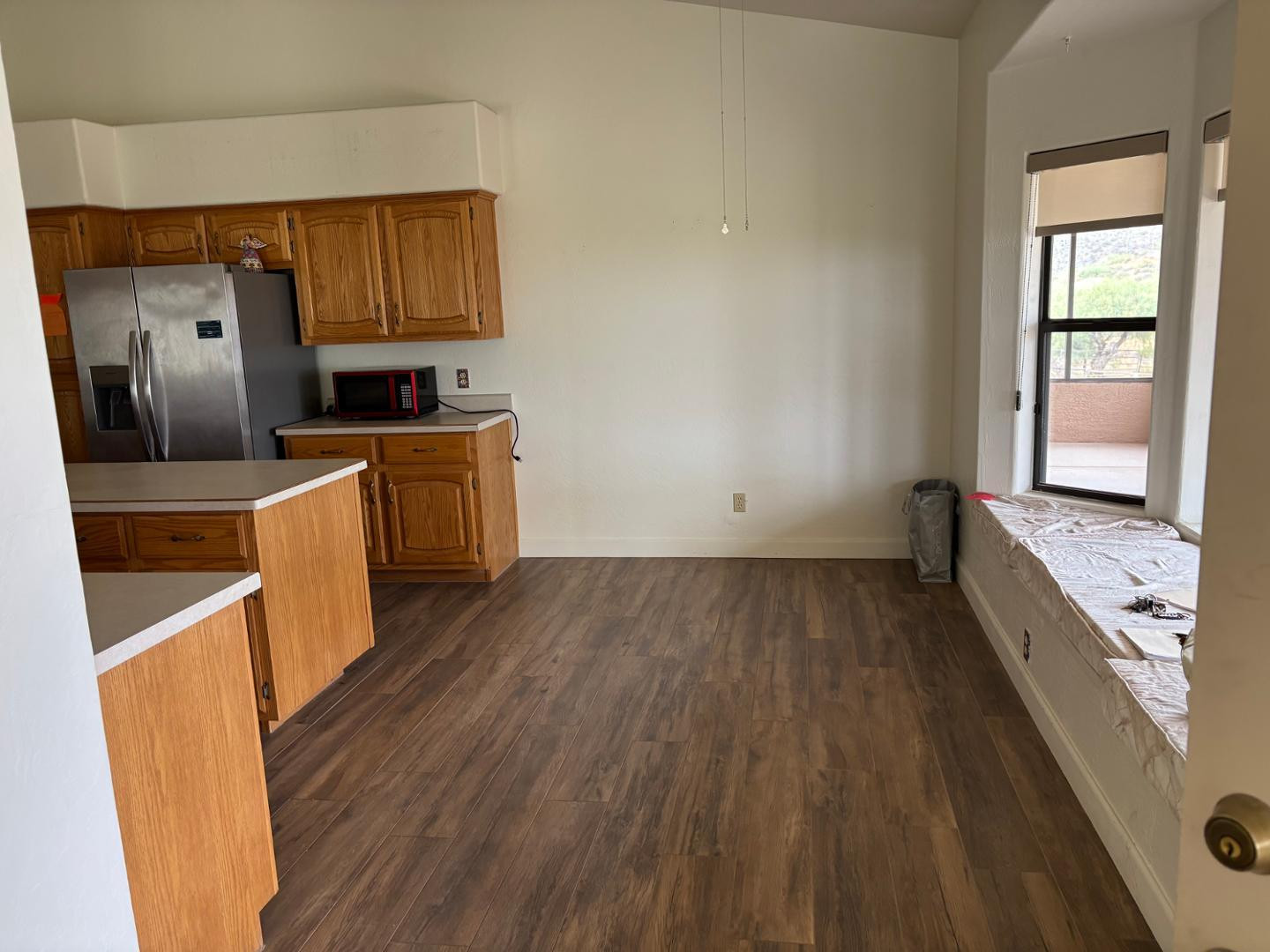 43003 North Old Mine Road Scottsdale, AZ 85262 - Photo 13 of 33 a kitchen with sink a refrigerator and wooden floor