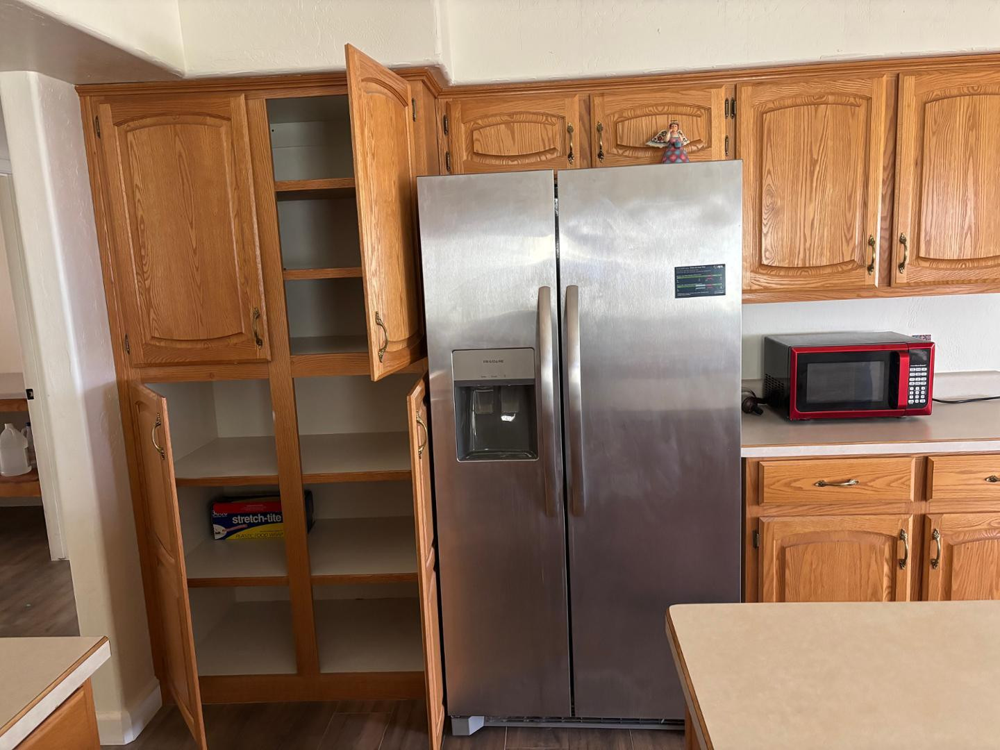 43003 North Old Mine Road Scottsdale, AZ 85262 - Photo 14 of 33 a kitchen with stainless steel appliances cabinets and a refrigerator