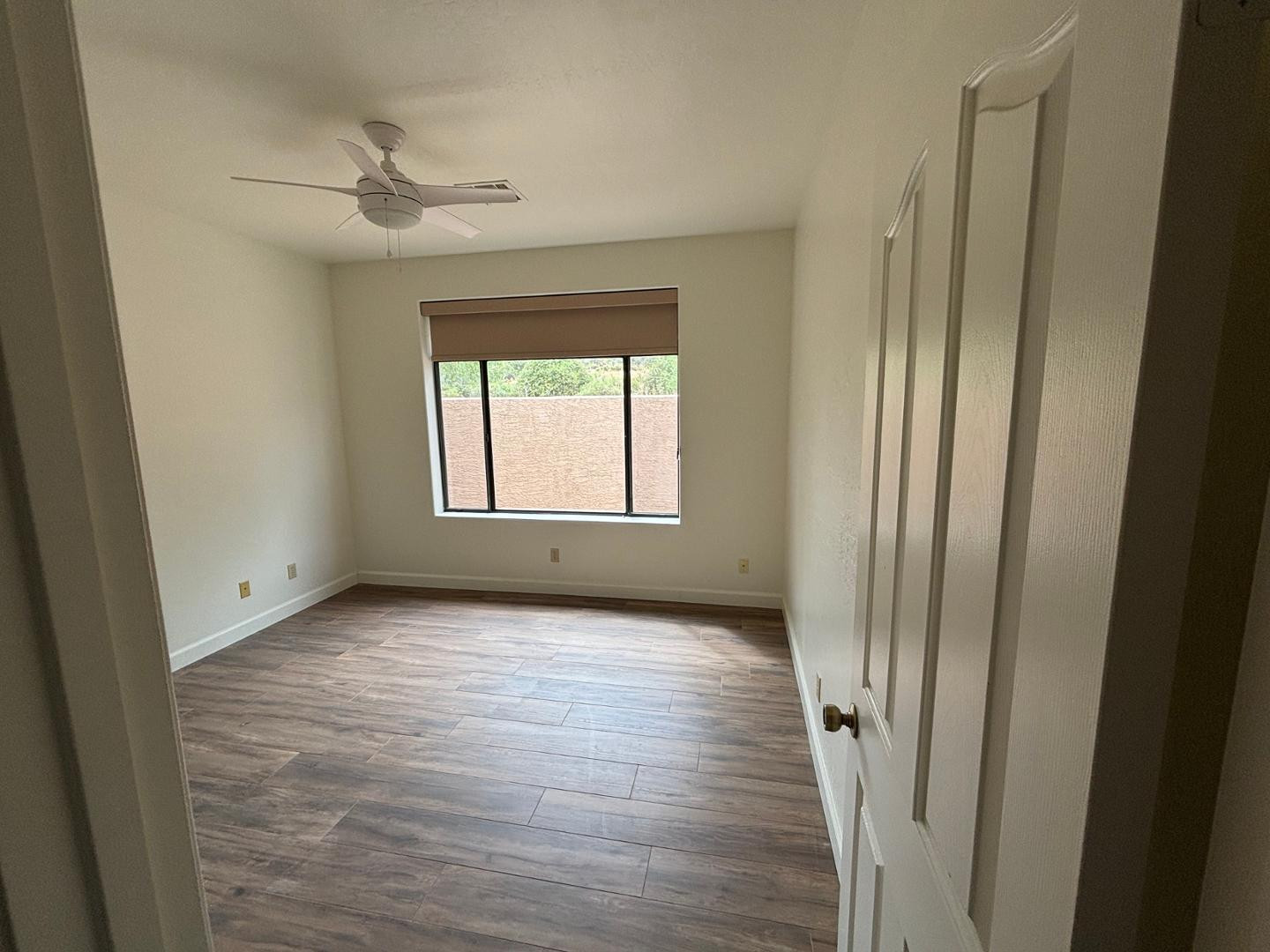 43003 North Old Mine Road Scottsdale, AZ 85262 - Photo 18 of 33 a view of an empty room and wooden floor