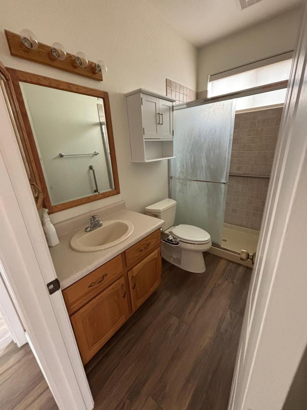 43003 North Old Mine Road Scottsdale, AZ 85262 - Photo 21 of 33 a bathroom with a sink a toilet a mirror and vanity