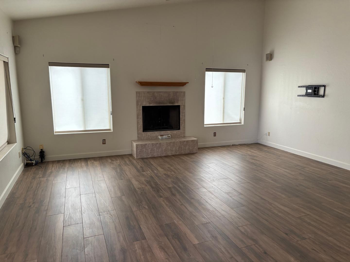 43003 North Old Mine Road Scottsdale, AZ 85262 - Photo 26 of 33 an empty room with wooden floor and windows