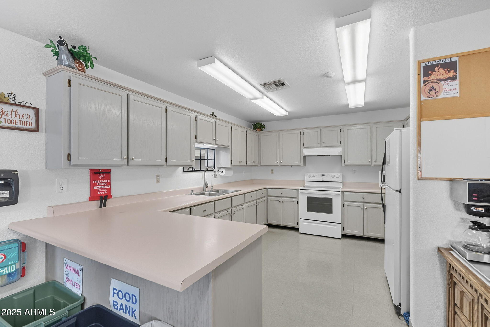 3700 South Tomahawk Road, Unit 39 Apache Junction, AZ 85119 - Photo 45 of 53 a kitchen with a sink a stove a refrigerator and a cabinets