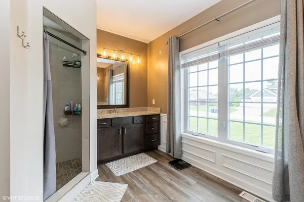a bathroom with a bathtub and a shower