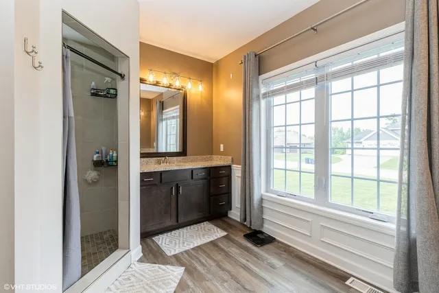 a bathroom with a bathtub and a shower