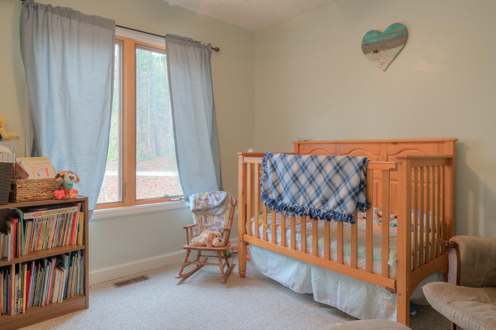 6551 Foxfire Road Catawba, VA 24070 - Photo 14 of 57 a bedroom with a bed and a book shelf