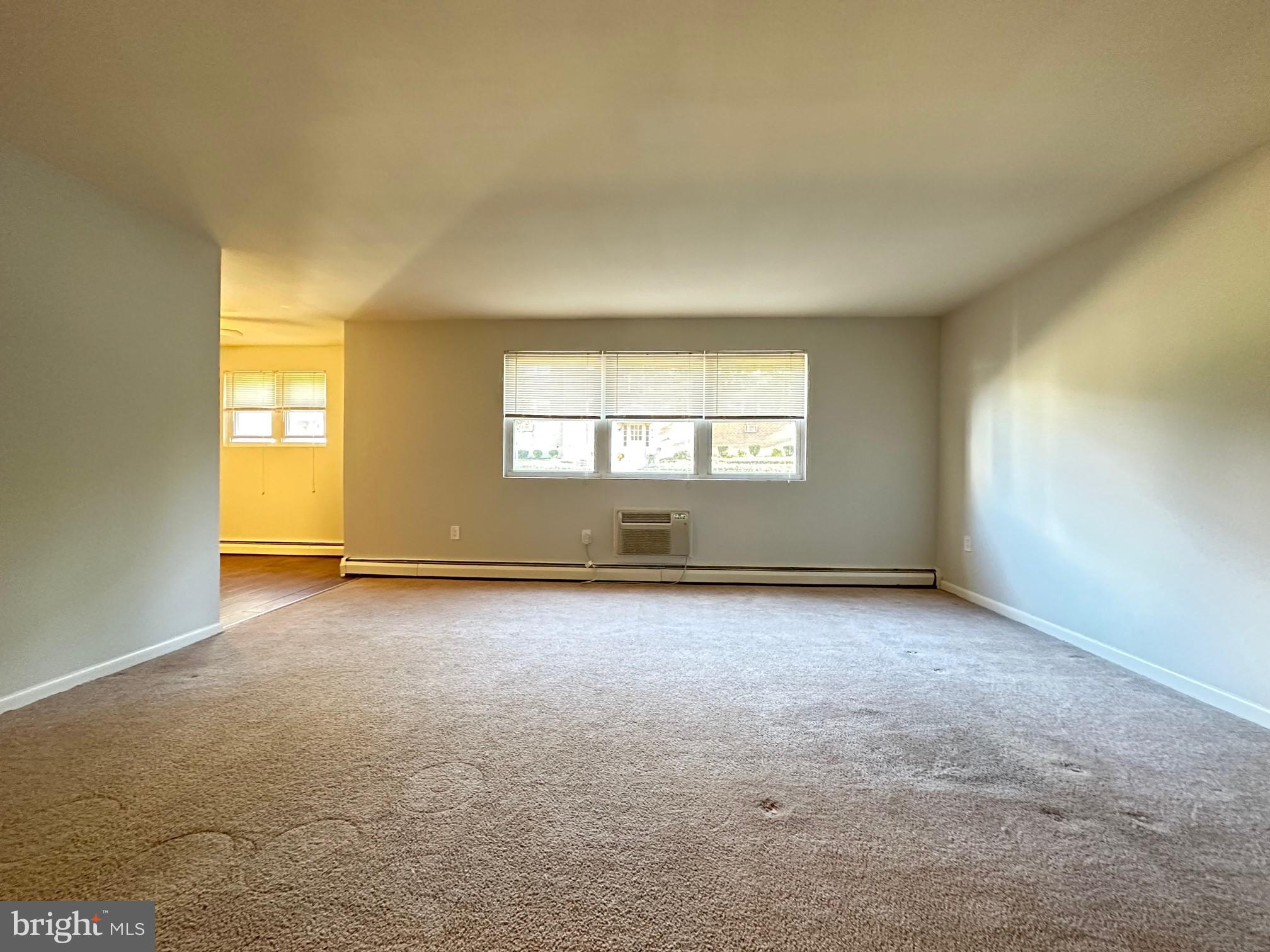 200 Spruce Street, Unit C11 Doylestown, PA 18901 - Photo 4 of 9 an empty room with windows