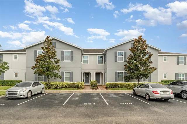 a view of a car parked in front of a house