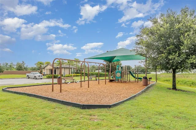 a view of a swimming pool with a bench