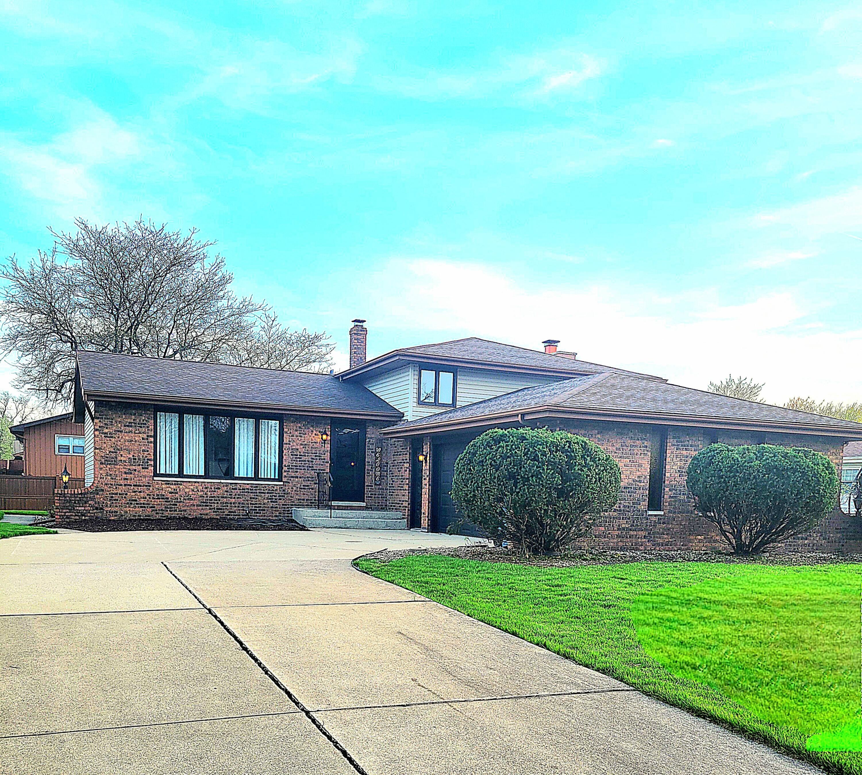 939 Devonshire Lane Dyer, IN 46311 - Photo 1 of 25 a front view of a house with garden