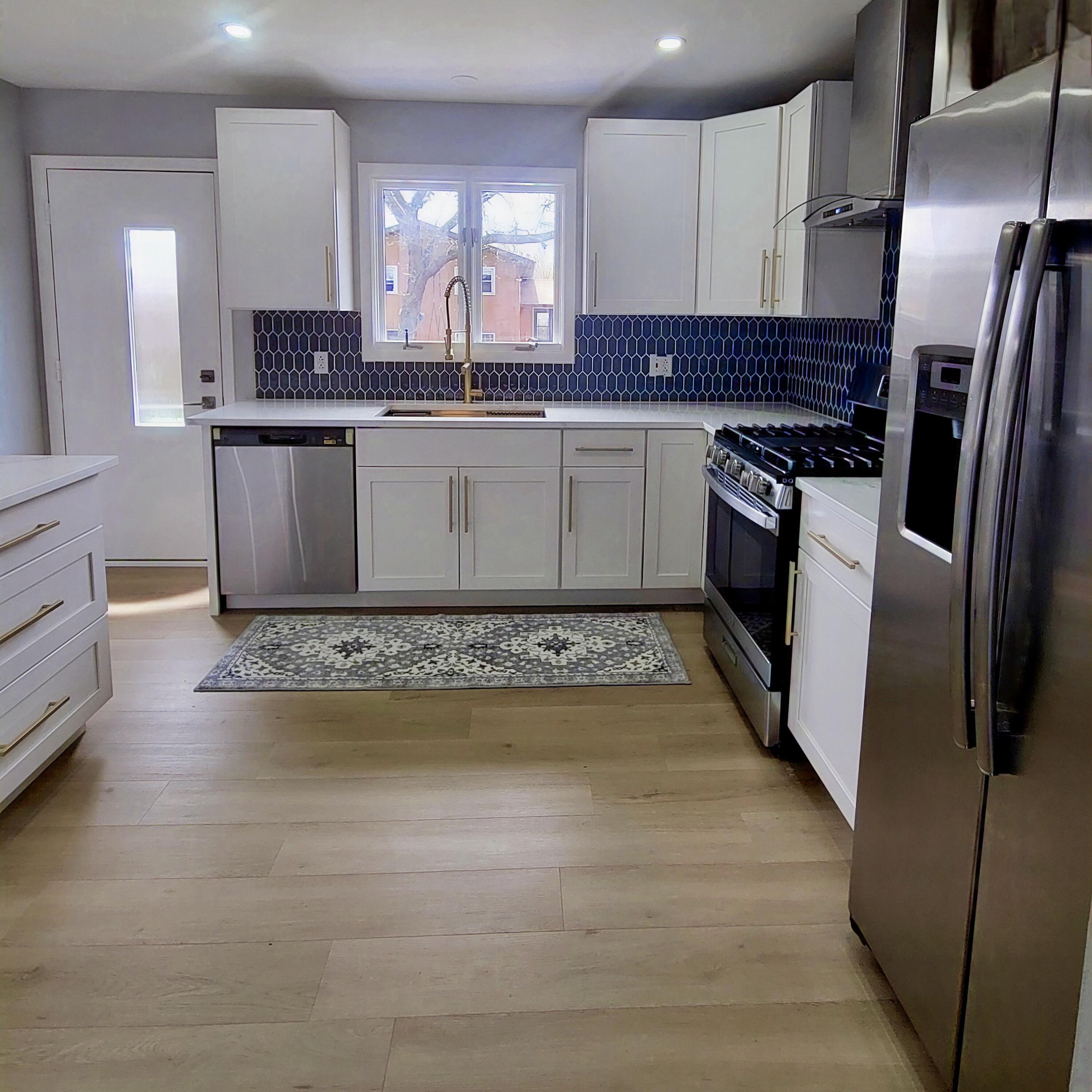 939 Devonshire Lane Dyer, IN 46311 - Photo 11 of 25 a kitchen with stainless steel appliances granite countertop a sink a stove a refrigerator and a microwave