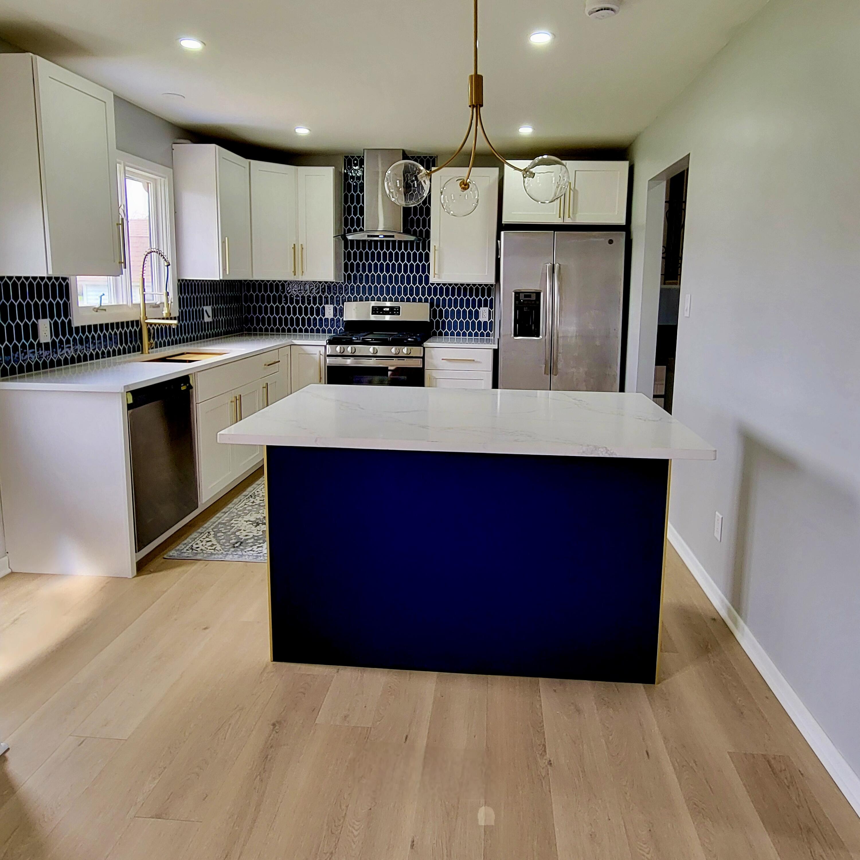 939 Devonshire Lane Dyer, IN 46311 - Photo 13 of 25 a kitchen with stainless steel appliances kitchen island granite countertop a stove a sink a refrigerator and a microwave