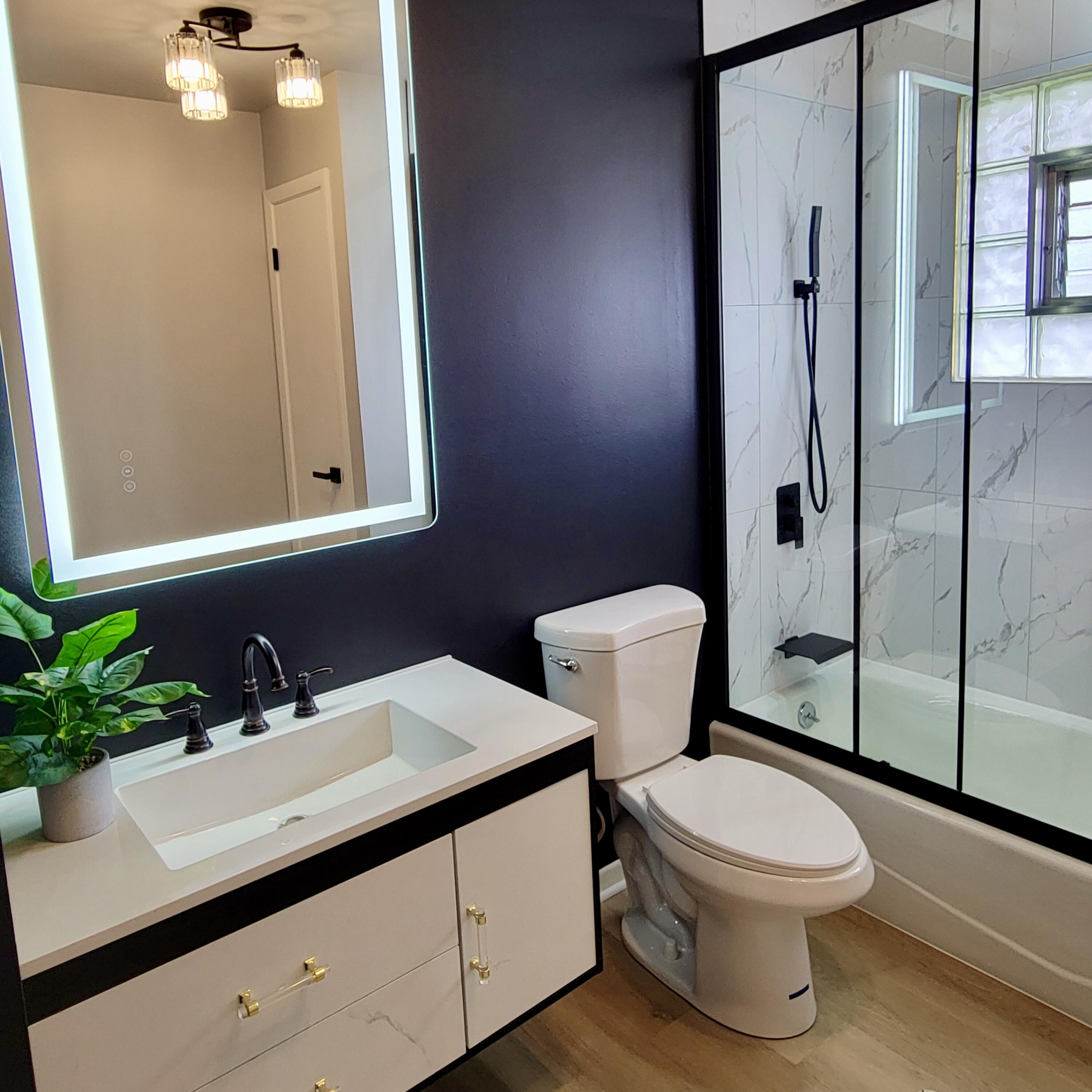 939 Devonshire Lane Dyer, IN 46311 - Photo 16 of 25 a bathroom with a toilet a sink and a mirror