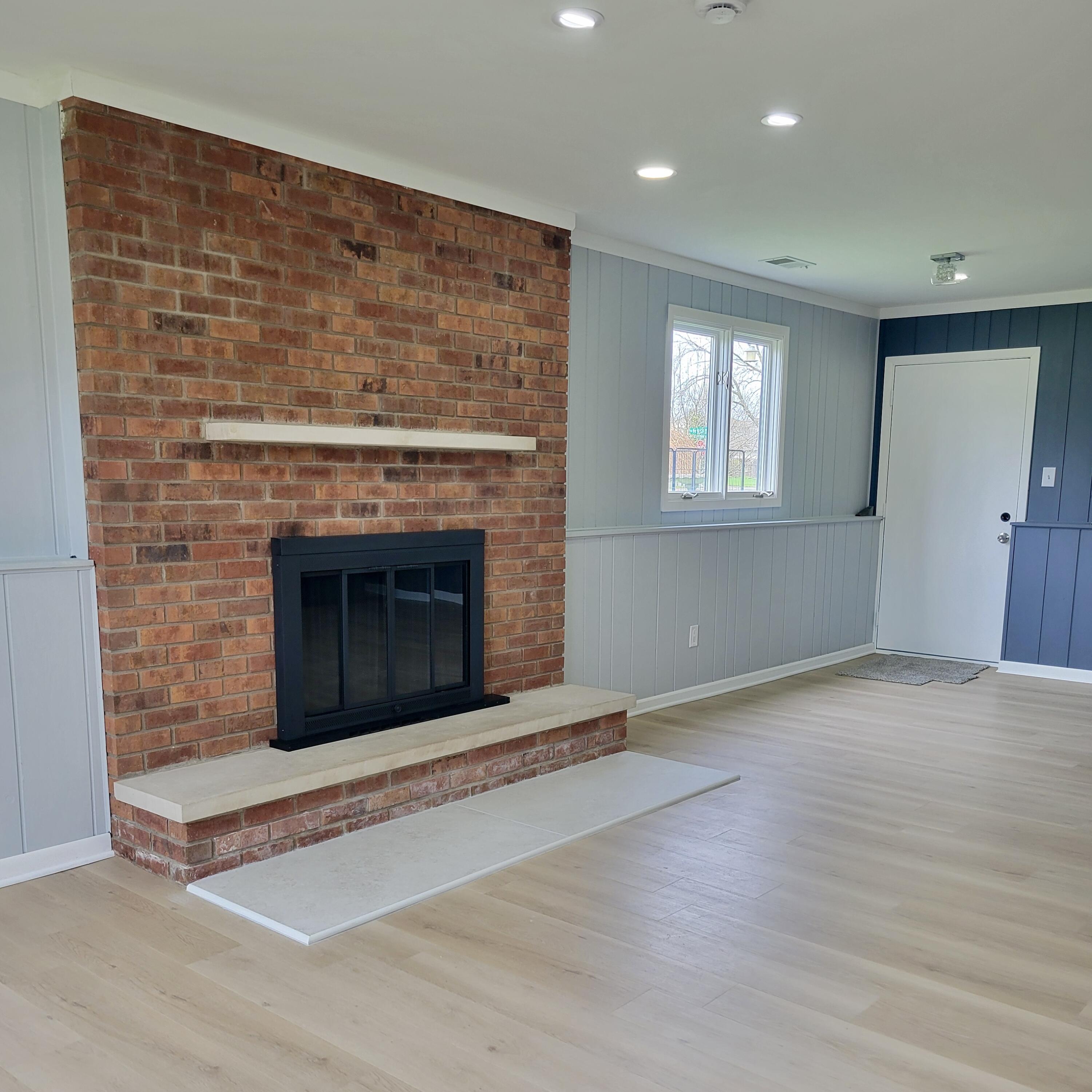 939 Devonshire Lane Dyer, IN 46311 - Photo 20 of 25 an empty room with windows and fireplace