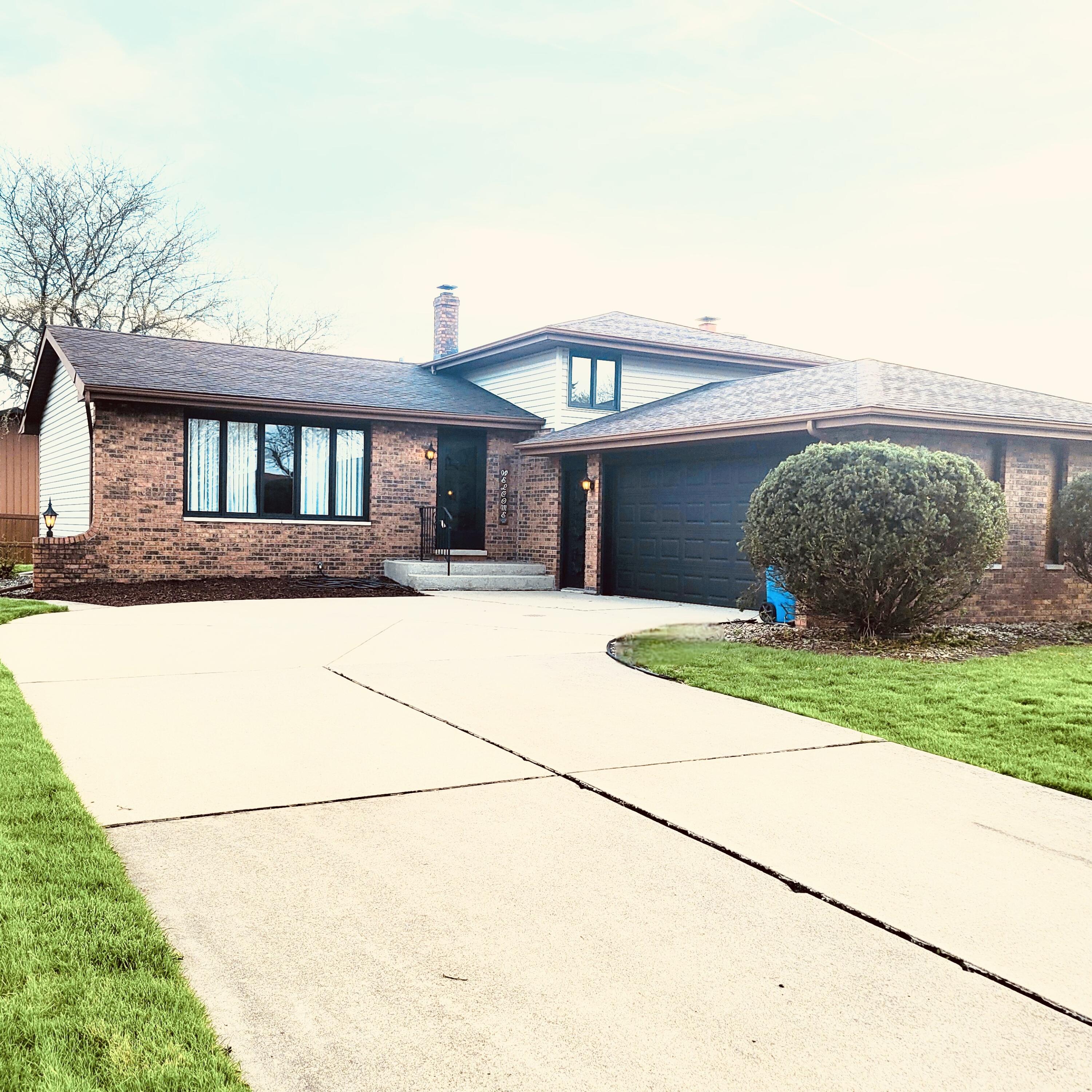 939 Devonshire Lane Dyer, IN 46311 - Photo 2 of 25 a house view with a garden space