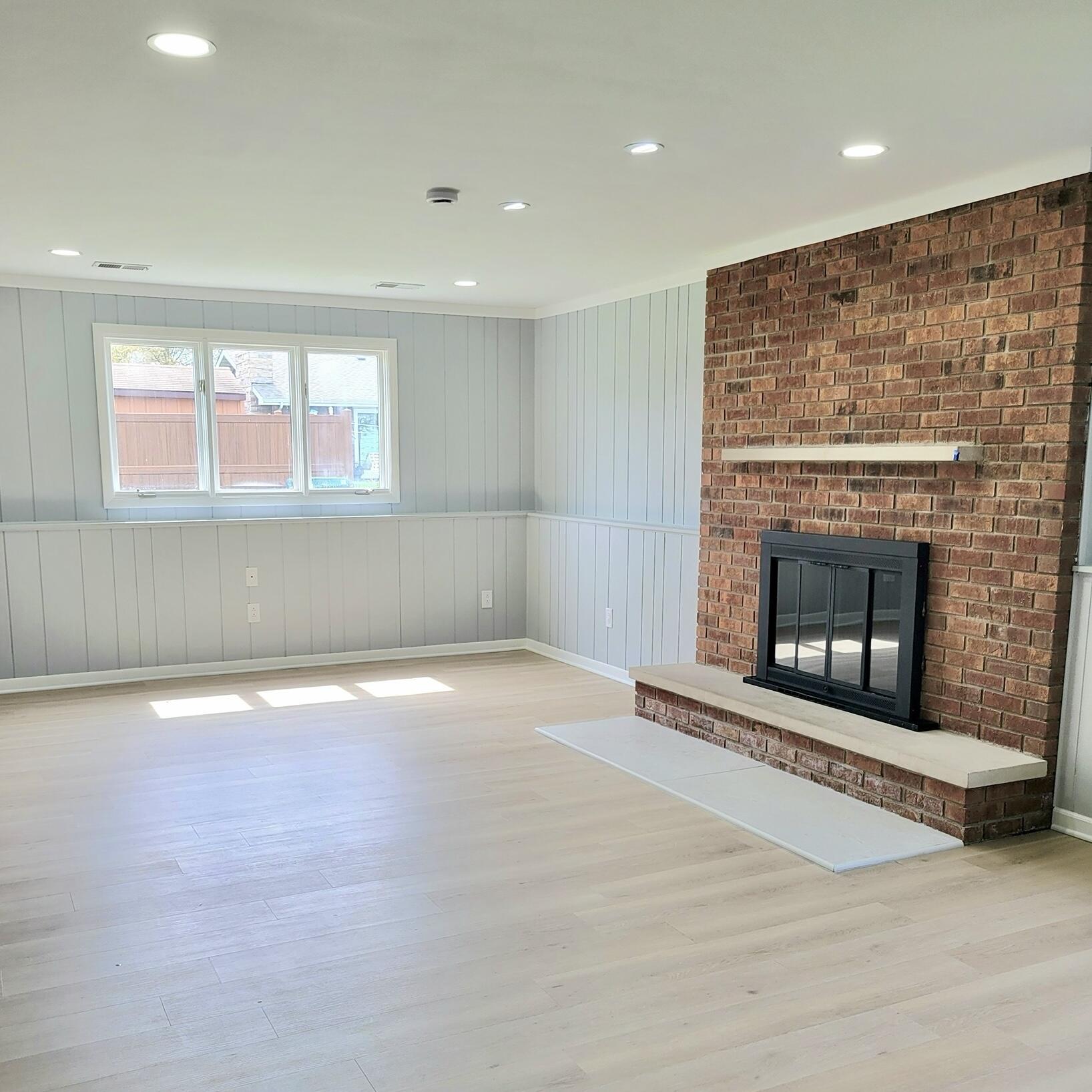 939 Devonshire Lane Dyer, IN 46311 - Photo 21 of 25 a view of an empty room with a fireplace and a window