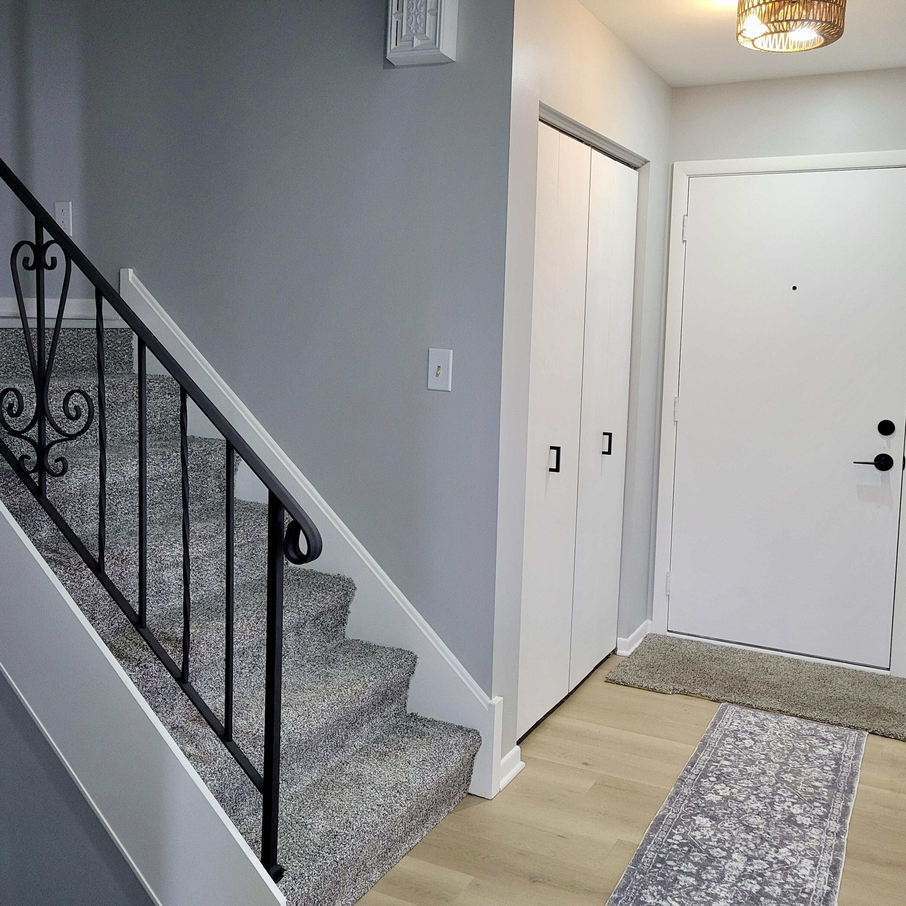 939 Devonshire Lane Dyer, IN 46311 - Photo 5 of 25 a view of staircase with white walls and a window