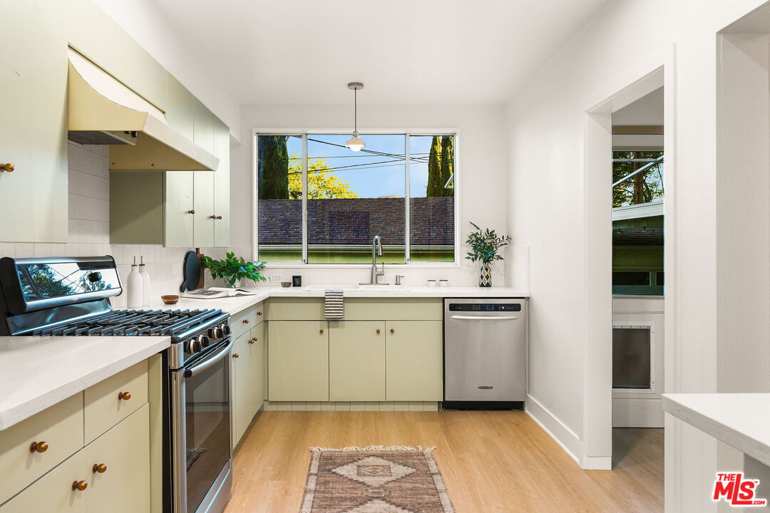 3330 Paraiso Way La Crescenta, CA 91214 - Photo 11 of 38 a kitchen with a sink stove and cabinets