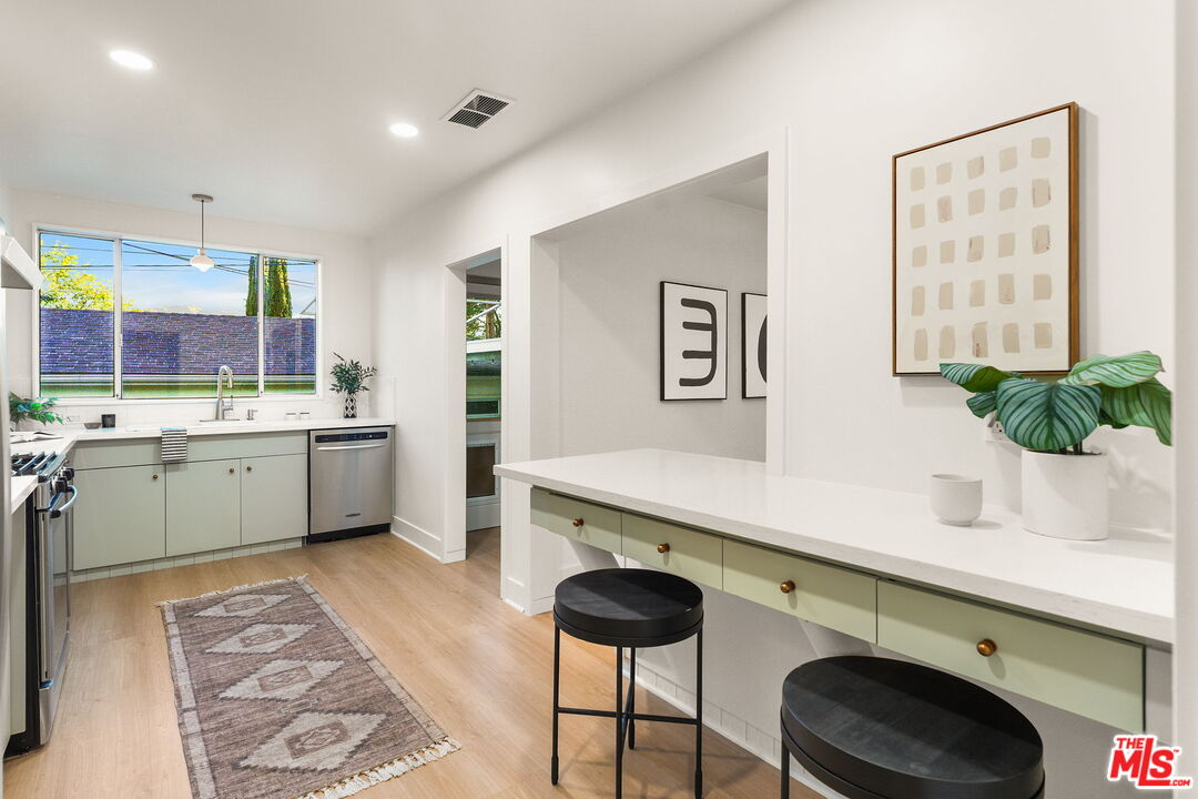 3330 Paraiso Way La Crescenta, CA 91214 - Photo 12 of 38 a kitchen with a sink cabinets and window