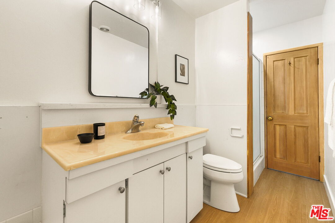 3330 Paraiso Way La Crescenta, CA 91214 - Photo 16 of 38 a bathroom with a sink a toilet and a mirror
