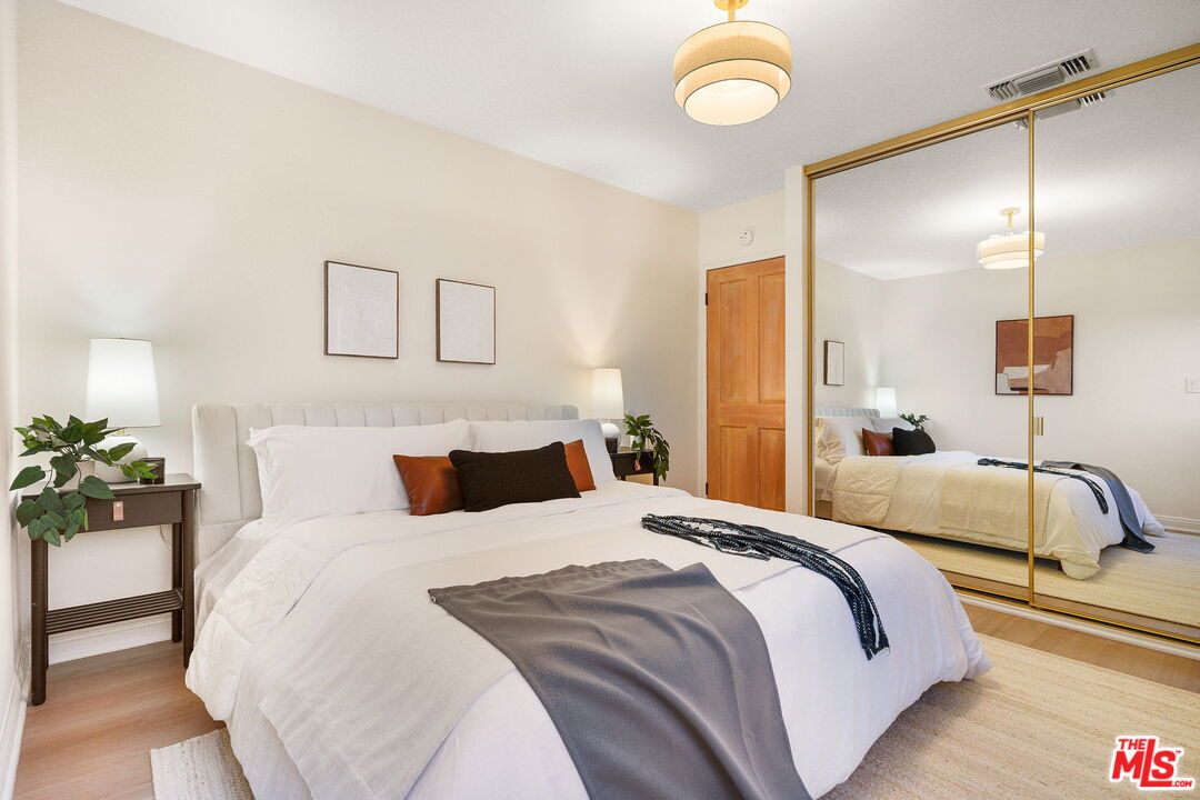 3330 Paraiso Way La Crescenta, CA 91214 - Photo 17 of 38 a bedroom with a bed and ceiling fan