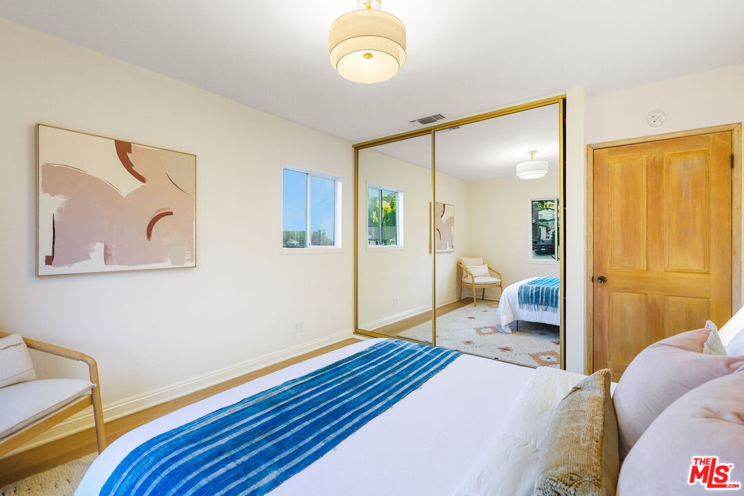 3330 Paraiso Way La Crescenta, CA 91214 - Photo 21 of 38 a bedroom with a bed and a lamp on dresser