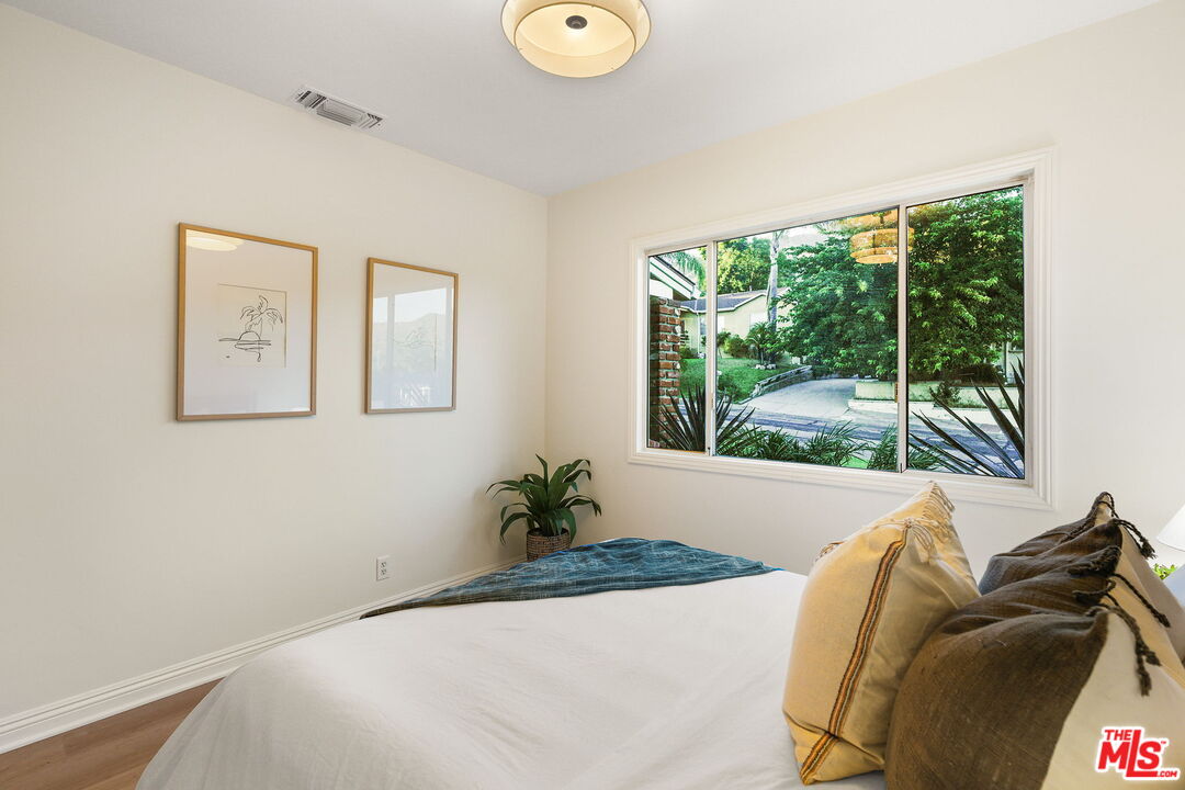 3330 Paraiso Way La Crescenta, CA 91214 - Photo 23 of 38 a bed sitting in a bedroom next to a window