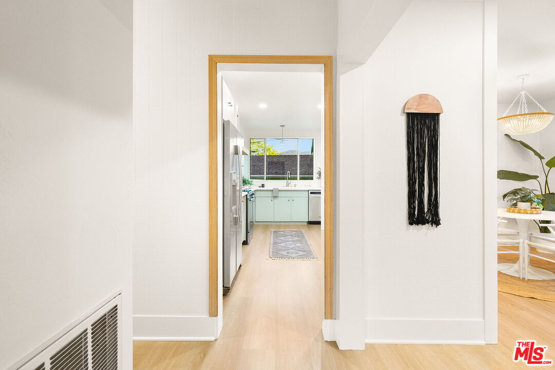 3330 Paraiso Way La Crescenta, CA 91214 - Photo 10 of 38 a view of a hallway with wooden floor and a living room